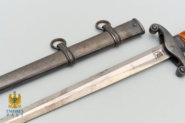 Straight double-edged sword with a textured scabbard and decorative rings on a pale background; Empire Past logo bottom left.