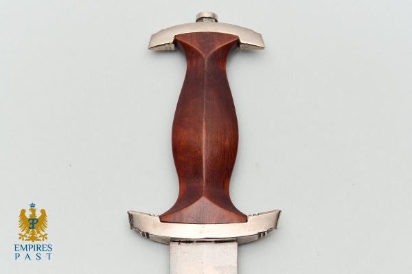 Dagger with a polished wood handle and metal crossguard centered on a pale background; Empires Past logo bottom-left.
