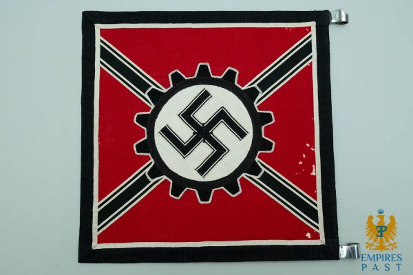 Red flag patch featuring a black swastika inside a white circle and a gear, on a red field.