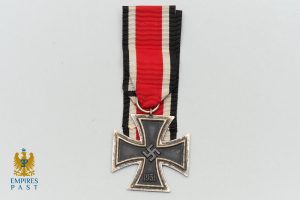 World War II German Iron Cross 1939 medal hanging from red, white, and black ribbon.